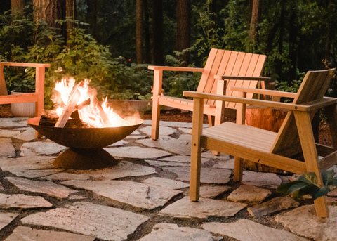Neighbor teak adirondack chairs around fire