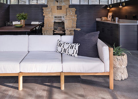 Neighbor outdoor sectional with throw cushions on a backyard
