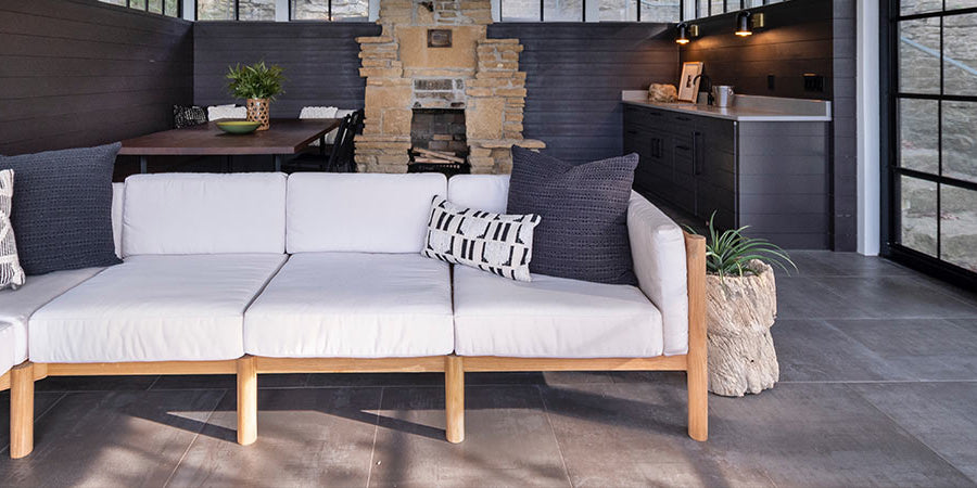 Neighbor outdoor sectional with throw cushions on a backyard
