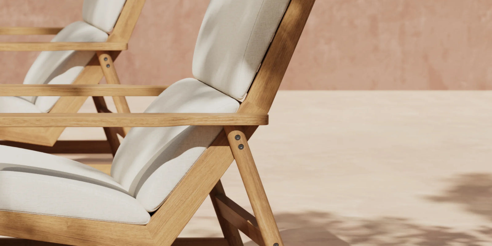 Two teak deck chairs with white cushions