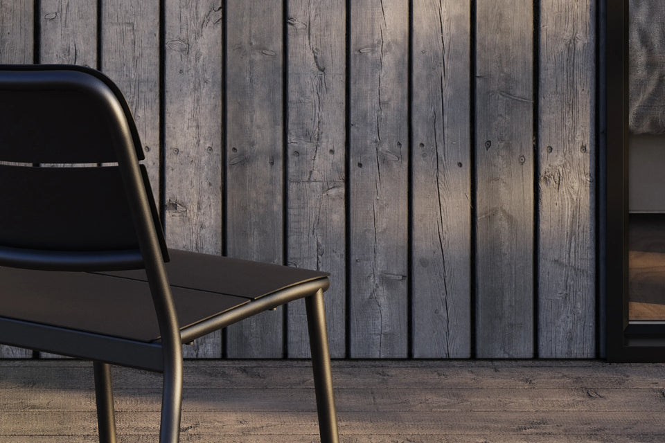 Overhead detail of Neighbor Bandwidth Dining Chair on wood deck in warm afternoon light
