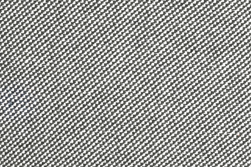 Closeup of Neighbor Crosshatch Throw Pillow woven grid texture in outdoor setting