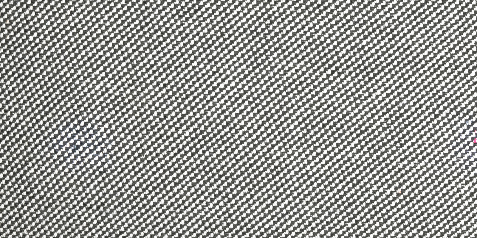 Closeup of Neighbor Crosshatch Throw Pillow woven grid texture in outdoor setting