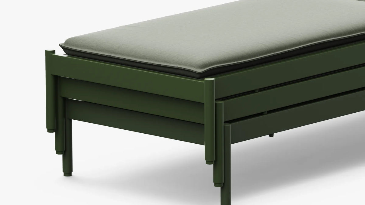 Sun lounger frame and cushion detail — angled view of Terra Sun Lounger end section in forest green aluminum with sage cushion on white background