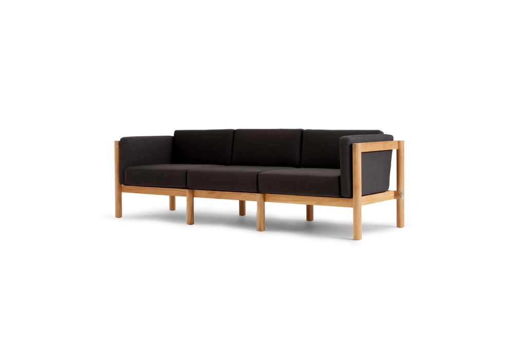 Haven Sofa, with cushion arms, in Coal, three-quarter view