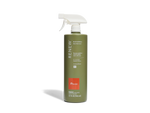 Green spray bottle with white nozzle on a white background