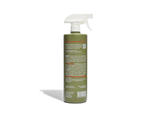 Green spray bottle with a white nozzle on a white background