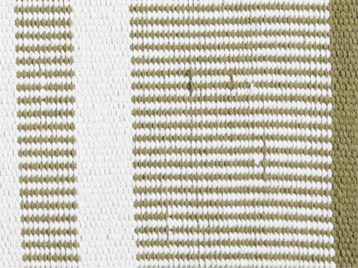 Close-up flat lay of Neighbor Dune rug in hand-woven olive and cream stripe texture