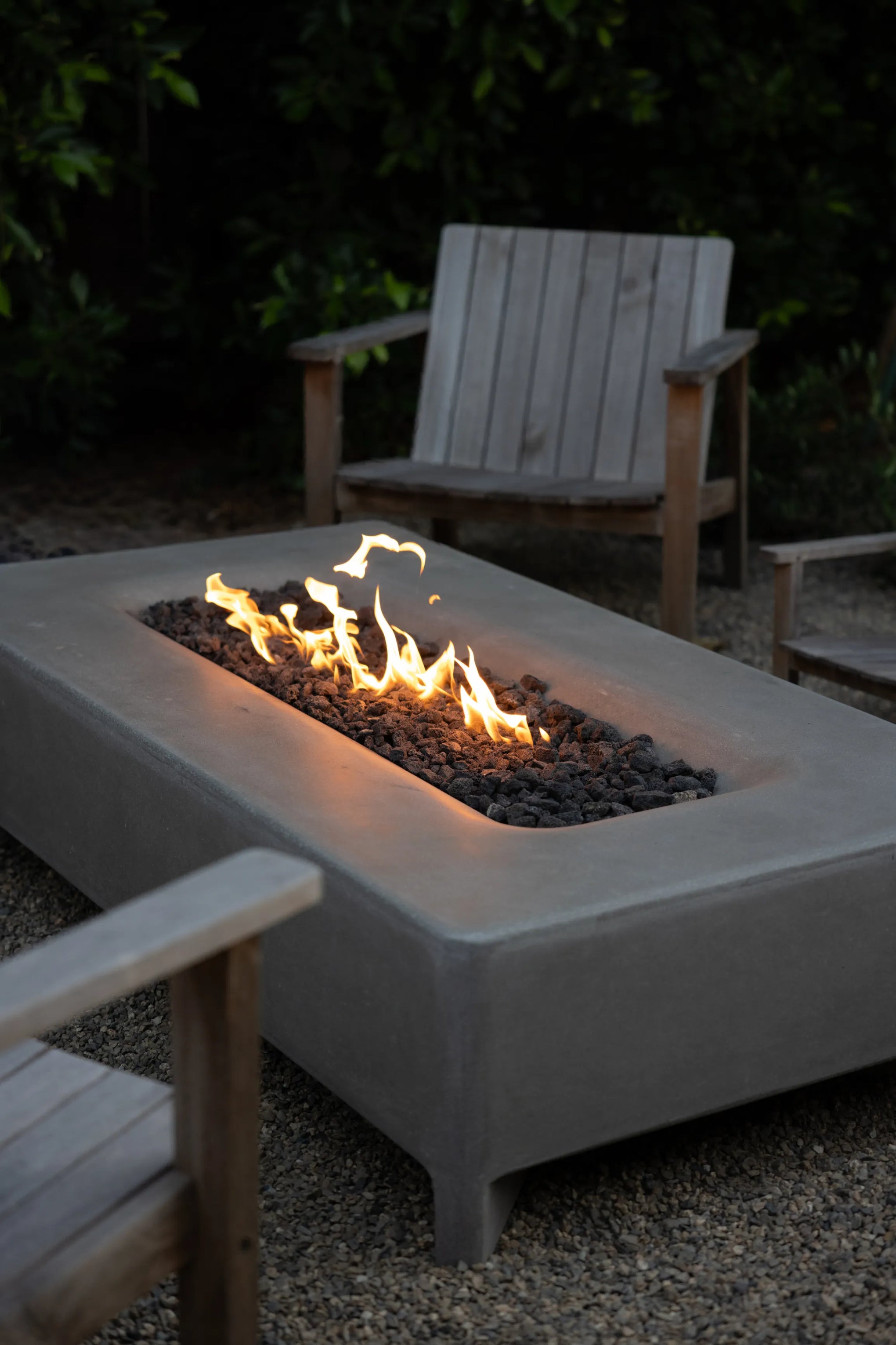 Montage of clips from Taylr Anne Castro's backyard which focus on her and her son enjoying their Rook Fire Table and some teak Low Chairs in the backyard.