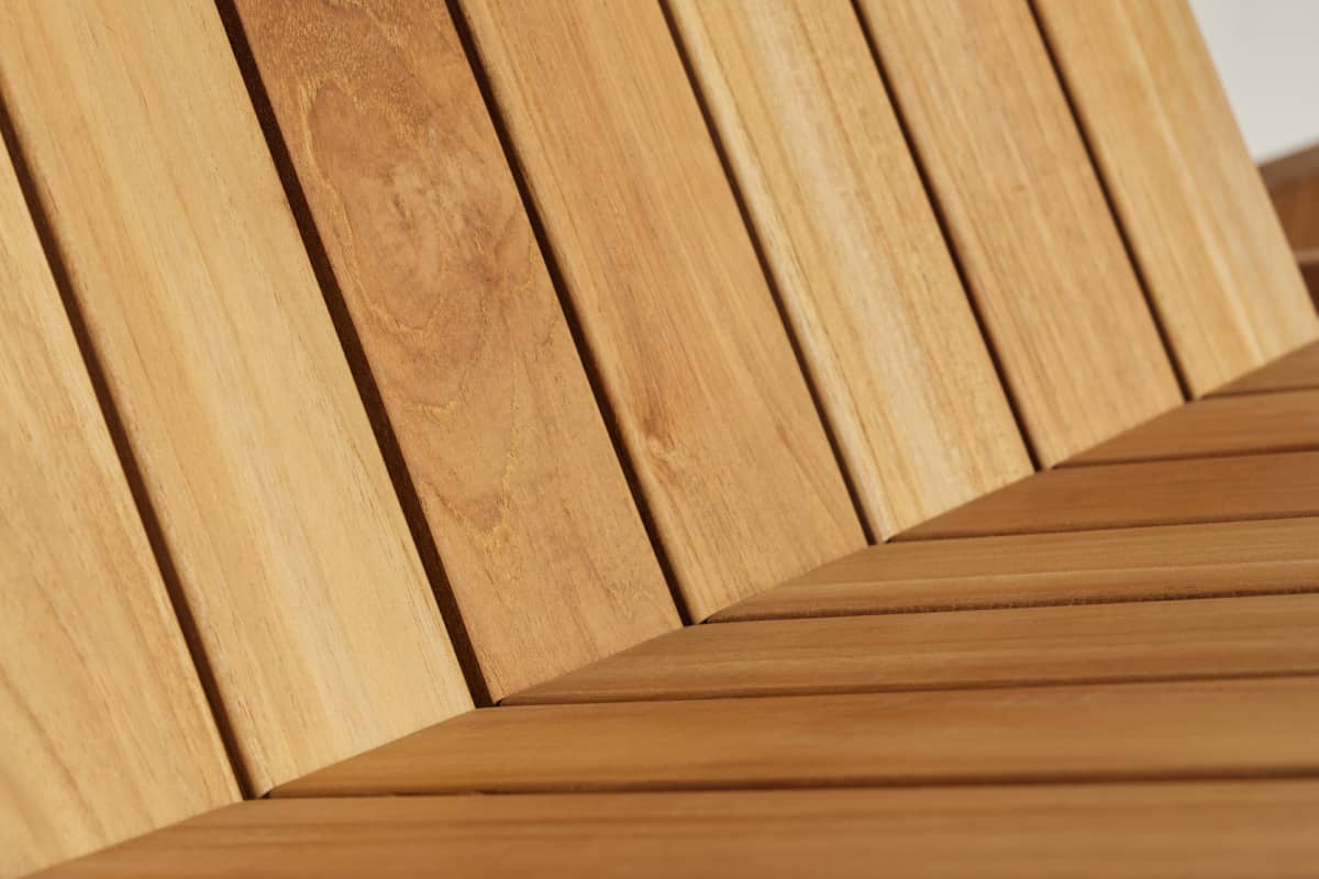 Close-up of teak planks from a portion of outdoor furniture